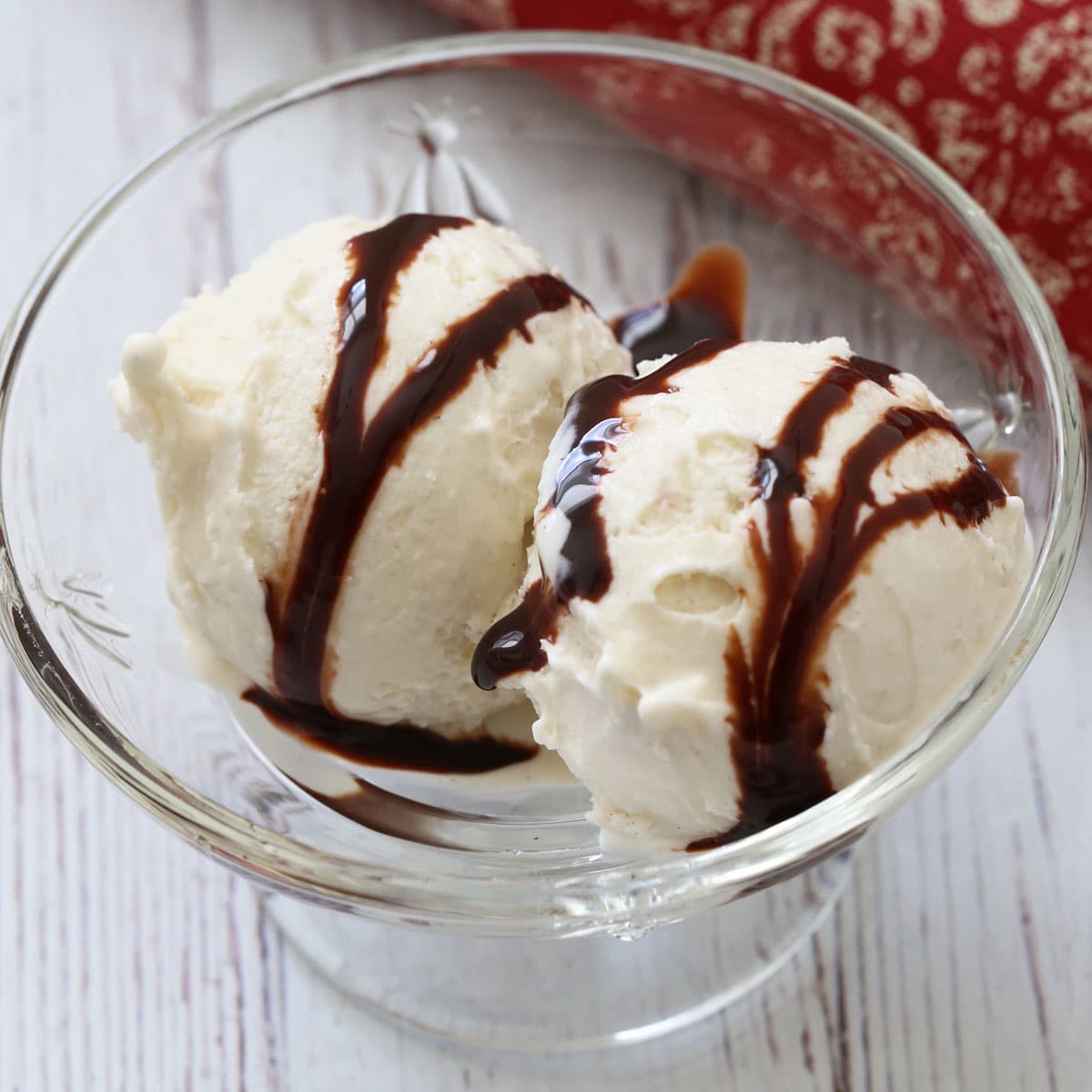 Frozen yogurt was drizzled with melted chocolate.