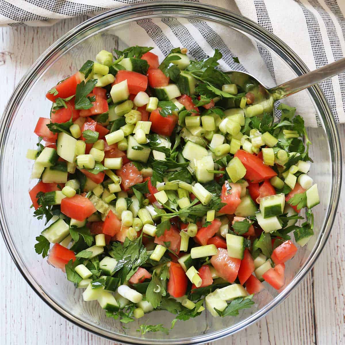 Israeli salad with scallions.