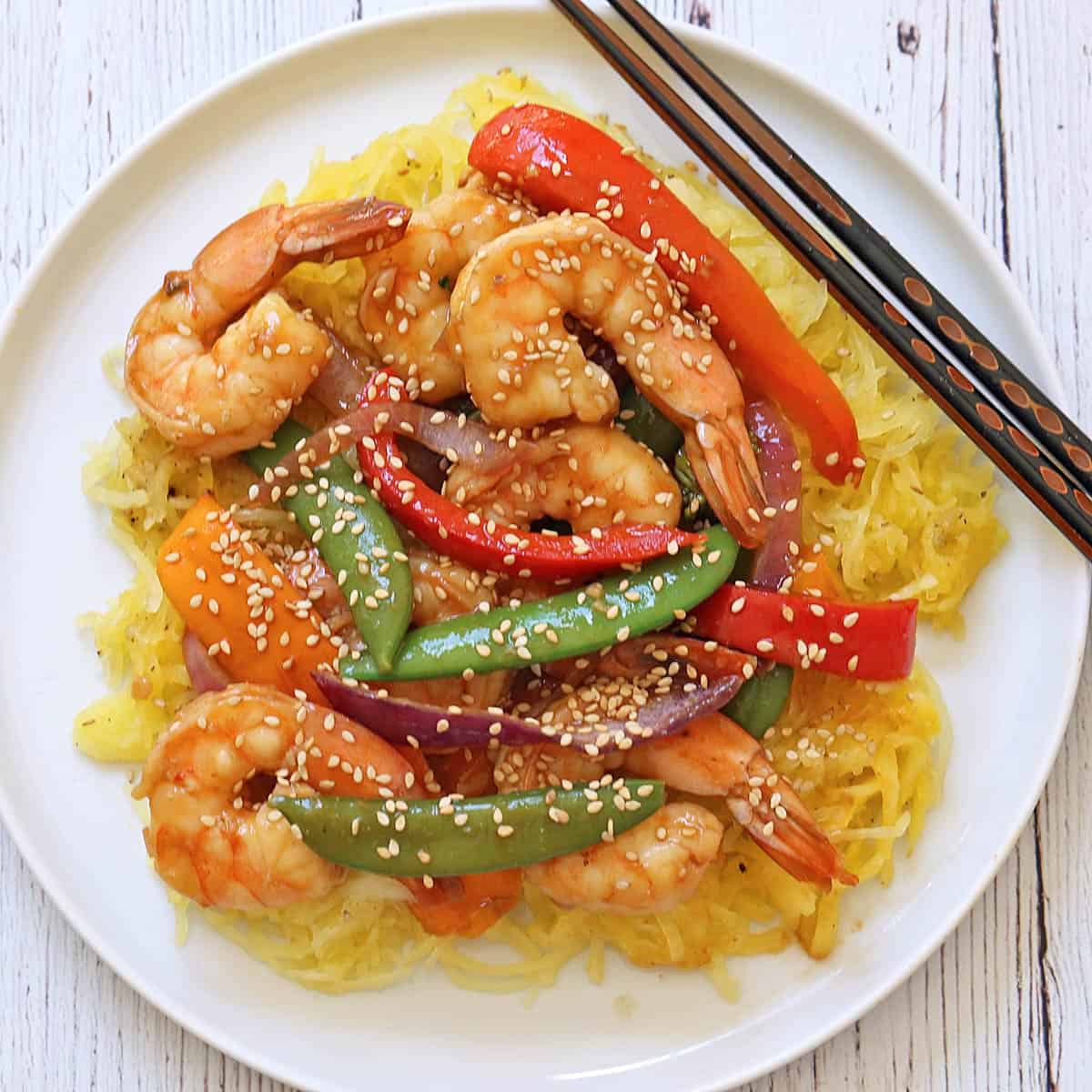 Shrimp stir-fry is served over spaghetti squash.