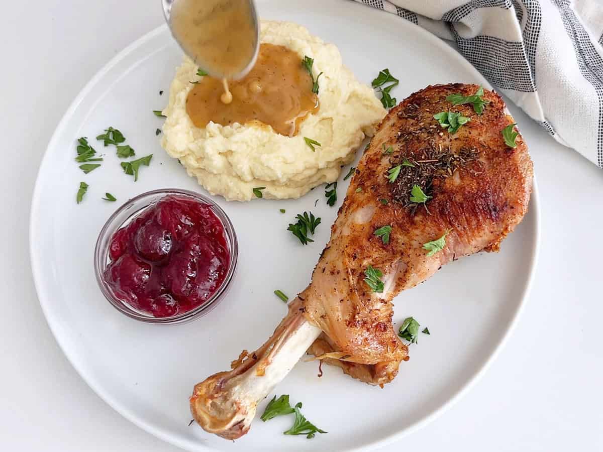 Spooning the gravy on mashed cauliflower.