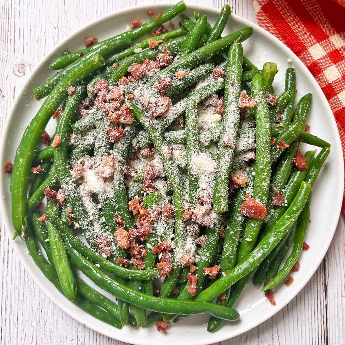 Green beans with bacon were topped with Parmesan.