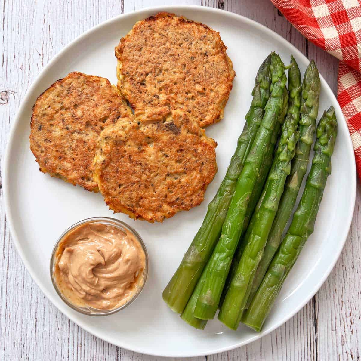 Microwave asparagus is served as a side dish to salmon cakes.