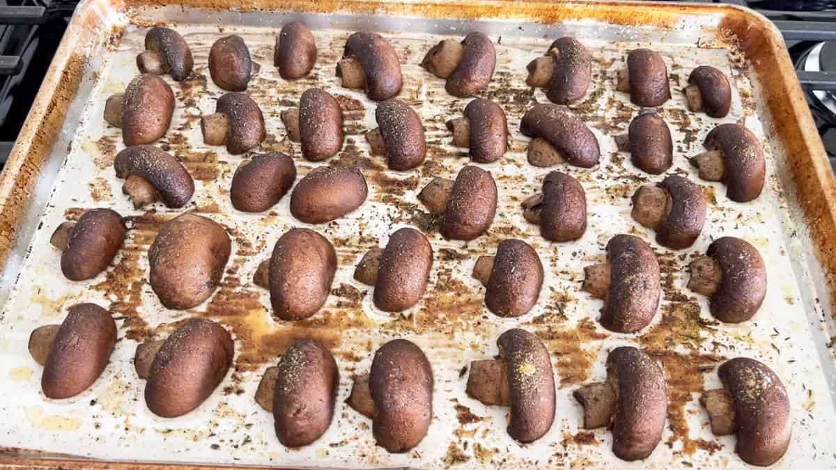 The mushrooms are spaced on the pan.