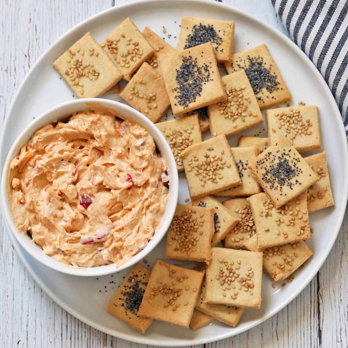 Pimento cheese is served with crackers for dipping.