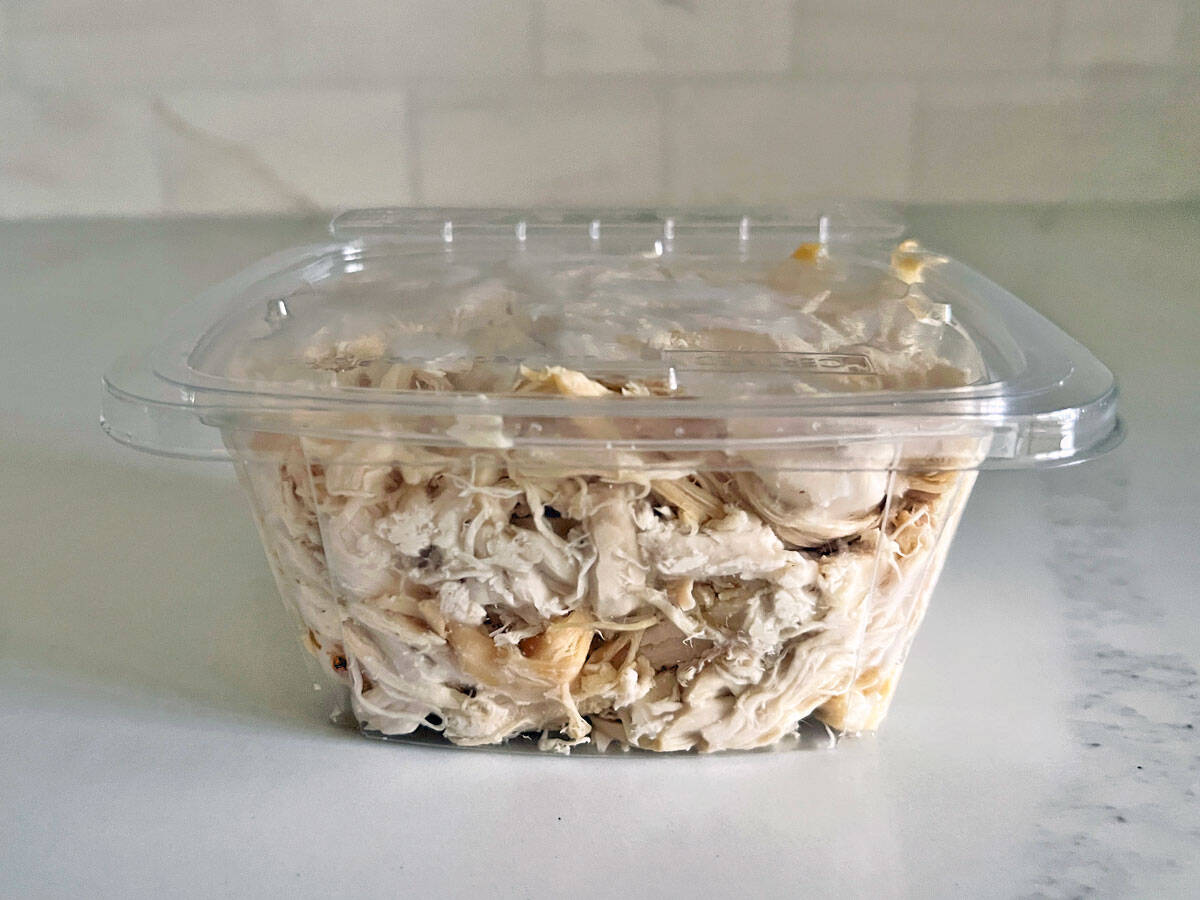 A store-bought package of shredded rotisserie chicken.