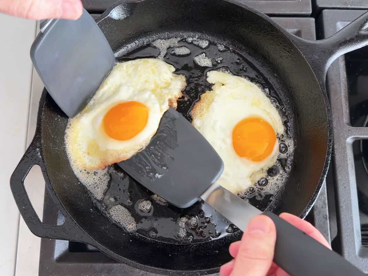 Cooking eggs in a cast-iron skillet.