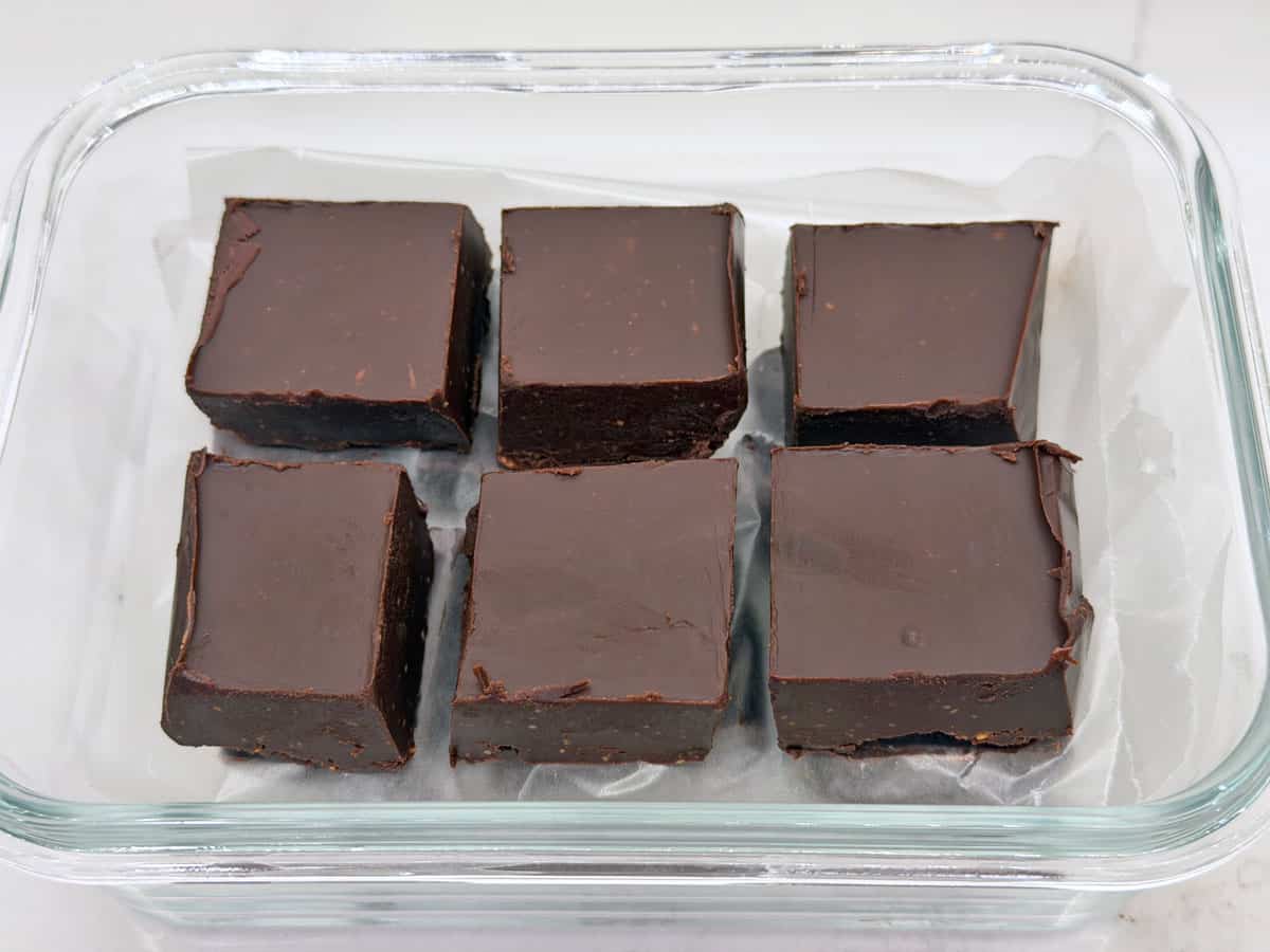 Fudge is stored in a glass container.