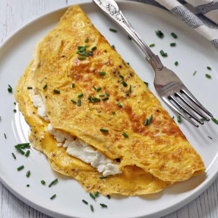 A goat cheese omelette on a plate.