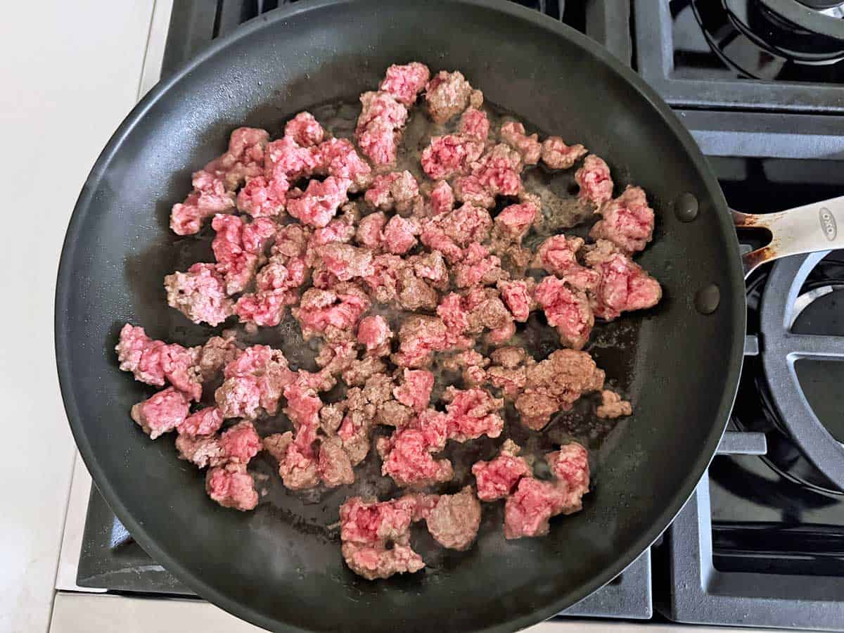 Cooking the ground beef with no added oil.
