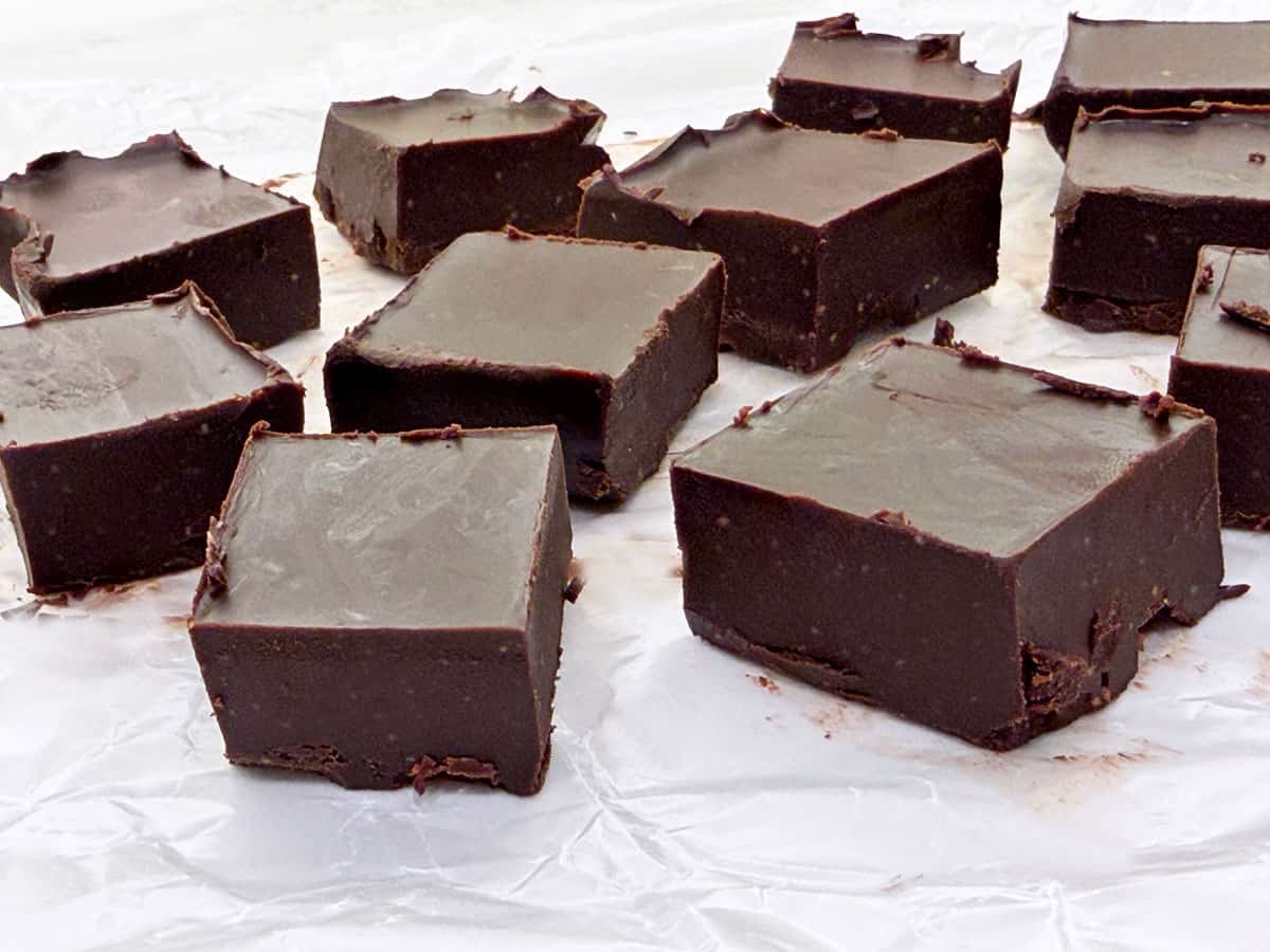 Thick fudge pieces on wax paper.