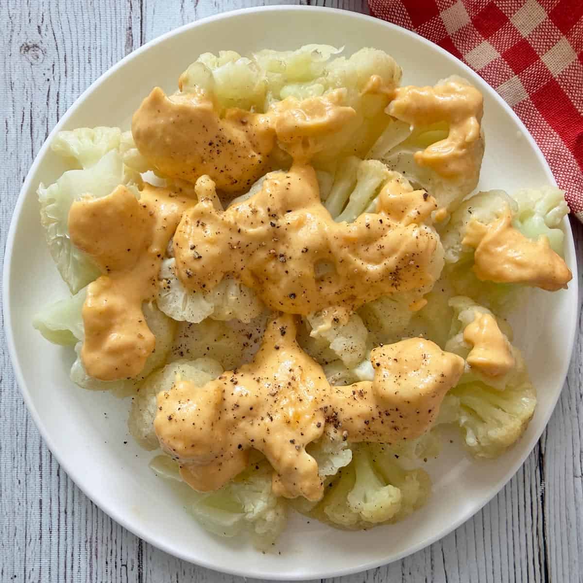 Cheese sauce is used as a cauliflower topping.