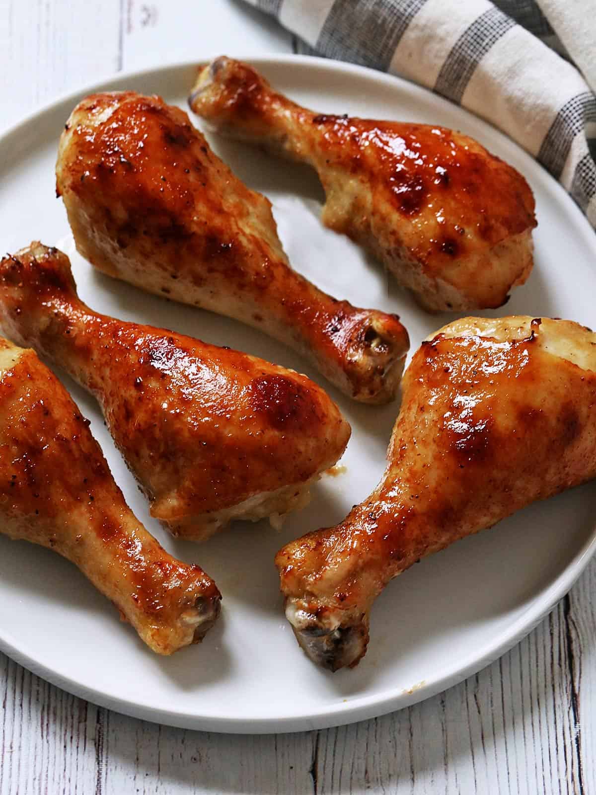 Honey garlic chicken is served on a plate.