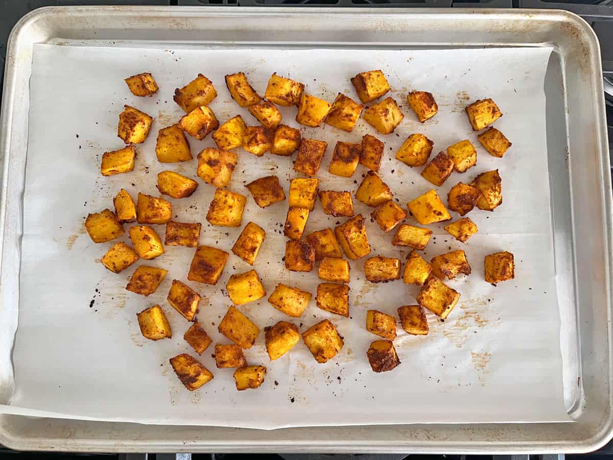 Smoked paprika roasted pumpkin on a baking sheet.