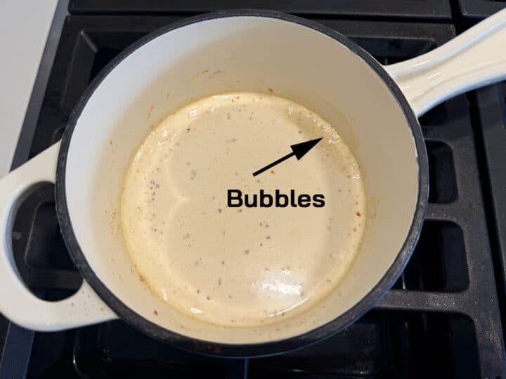 The heavy cream bubbles.